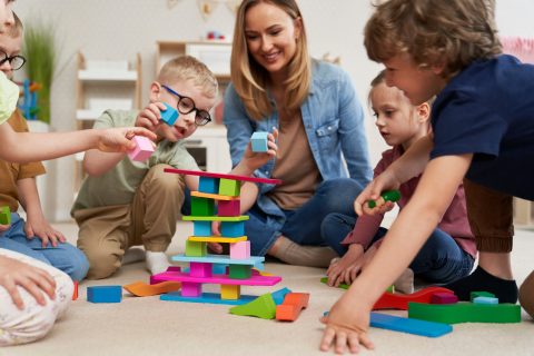 Children,Playing,With,Toy,Blocks,In,The,Kindergarten