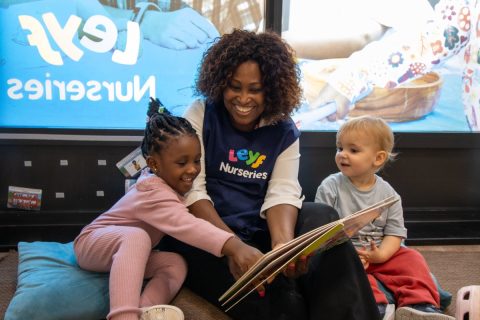 Toddlers reading a book - Medium